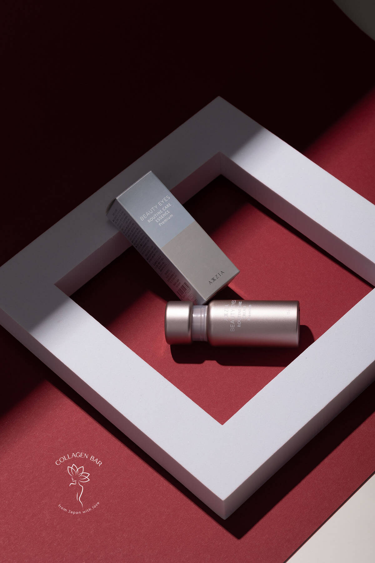 Сироватка AXXZIA Beauty Eyes Routine Care Essence Premium флакон та коробка в абстрактних геометричних фігурах