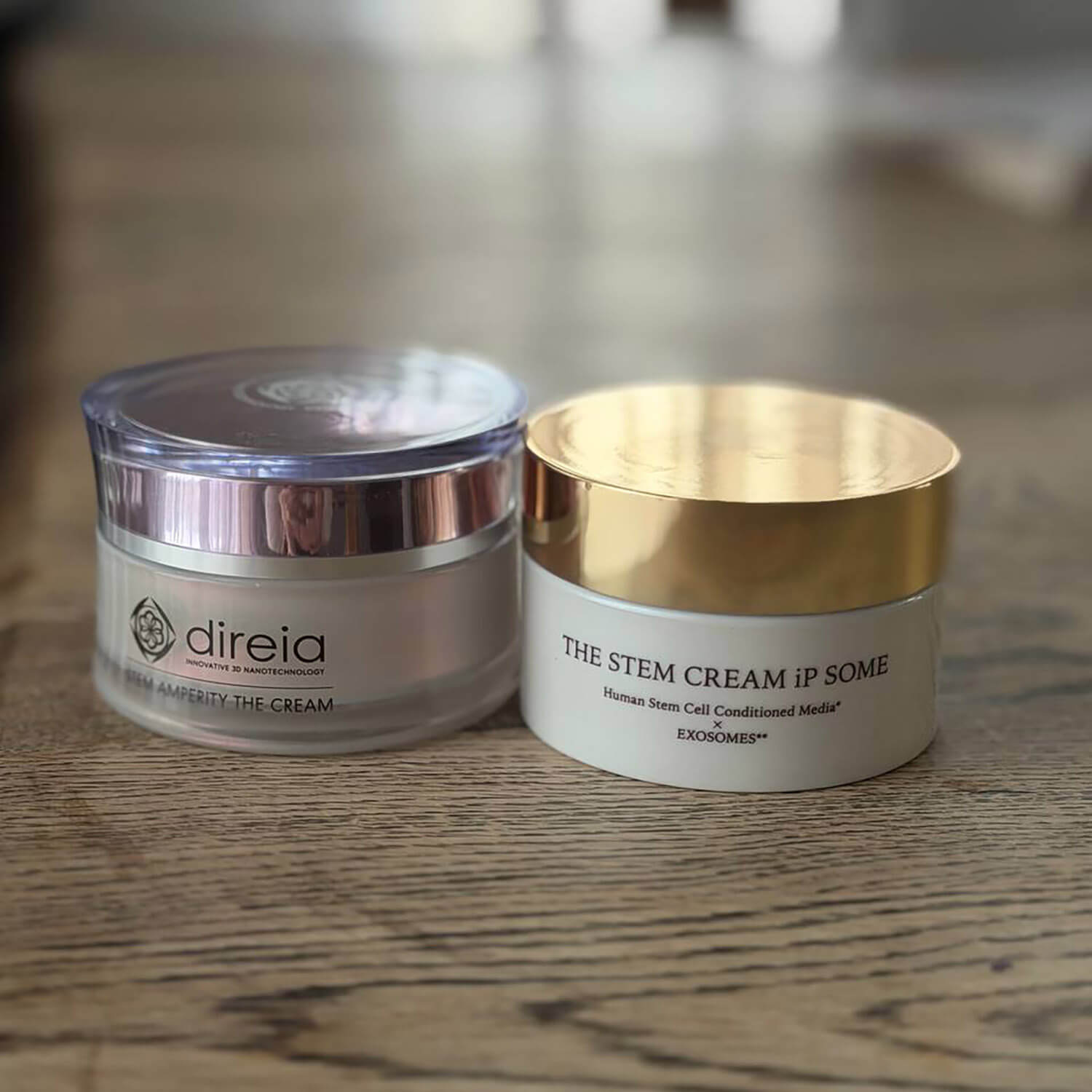 Два креми поруч на столі: DIREIA Stem Amperity The Cream і крем STEM Cream ip SOME.