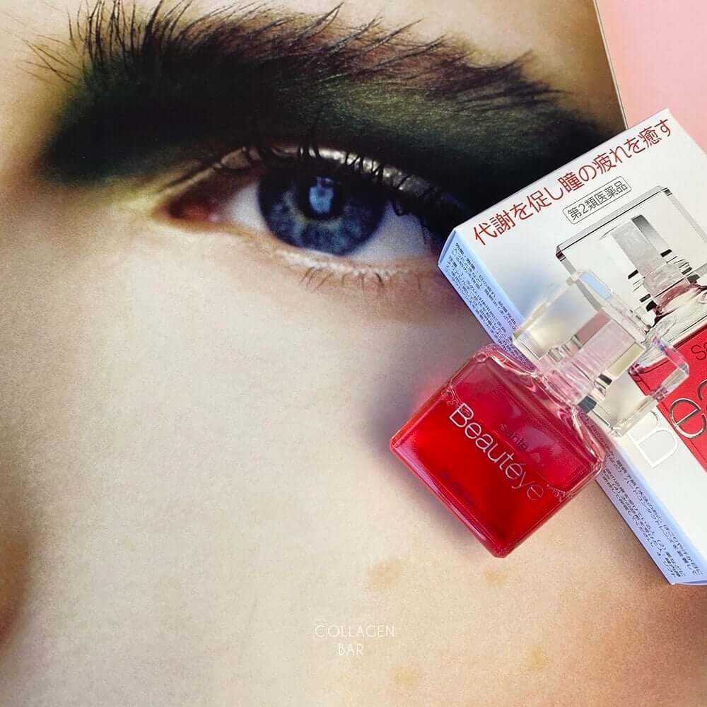 Капли для глаз Sante Beauteye рядом с журнальной фотографией женского глаза с макияжем
