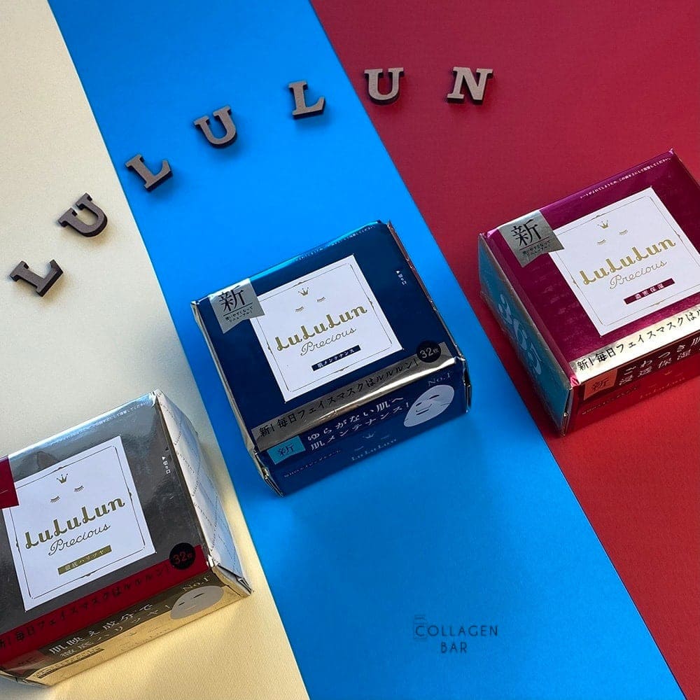 Маски LuLuLun Precious в упаковках по 32 штуки на полосатом фоне и словом LULULUN, выложенным деревянными буквами сверху