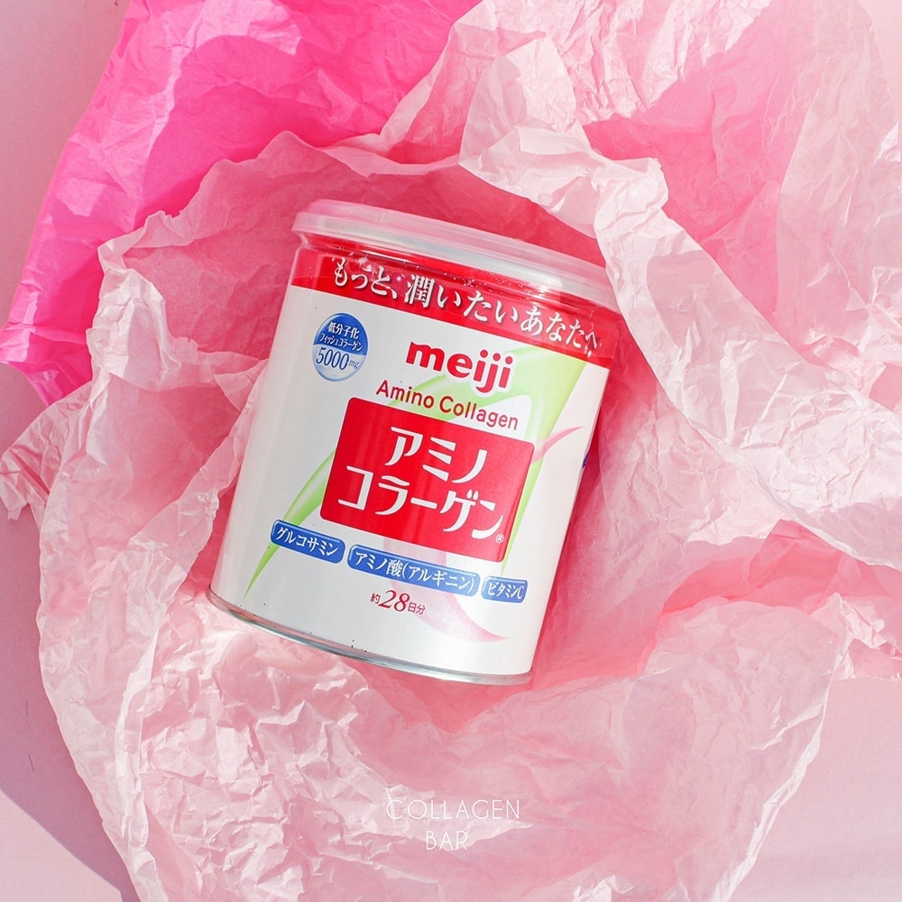 Коллаген Meiji Amino Collagen у банці на рожевому подарунковому папері