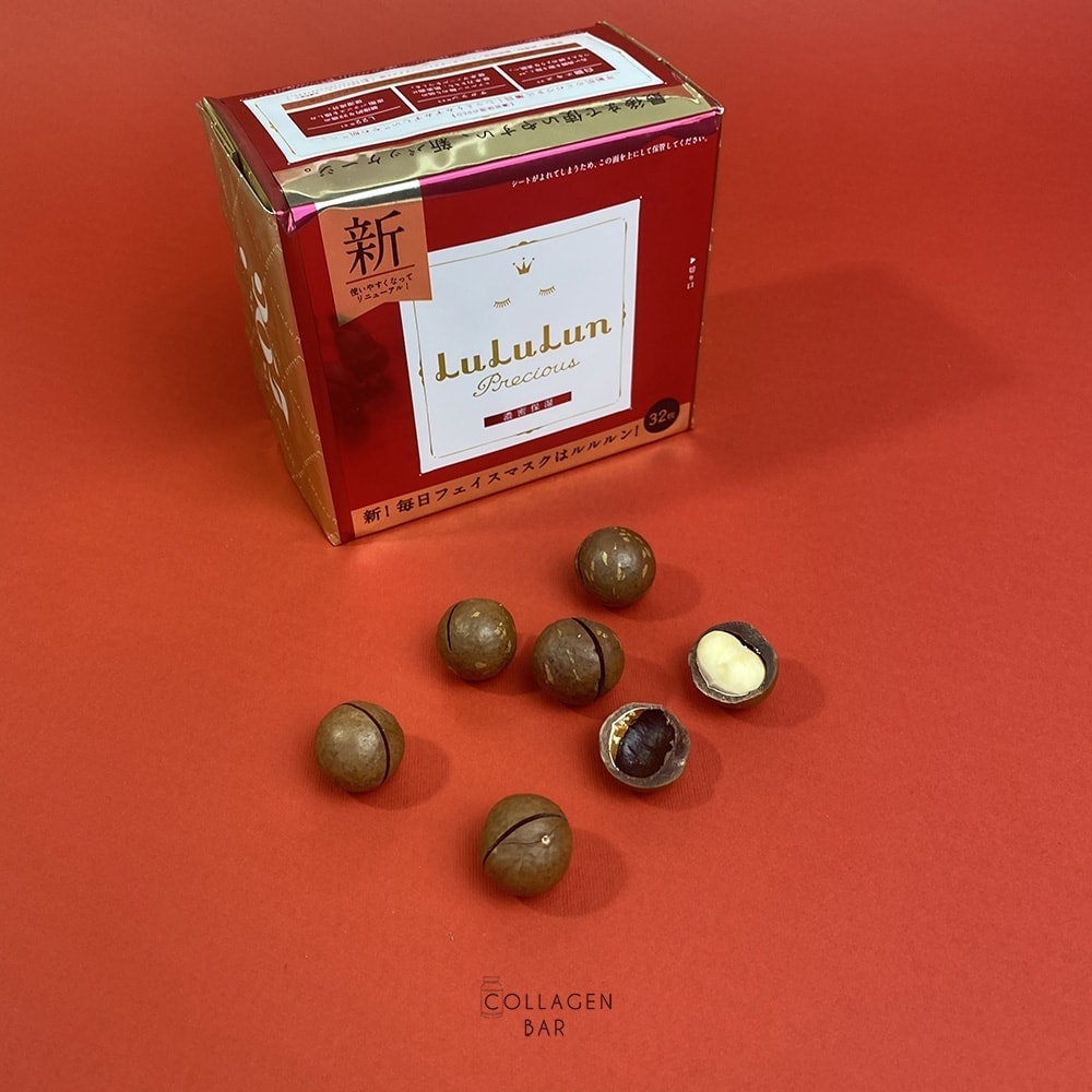 Маска LuLuLun Precious RED в упаковке на 32 штуки и орехи макадамии на красном фоне
