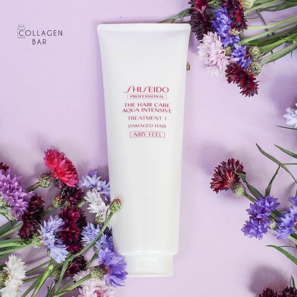 Кондиціонер для волосся Shiseido Aqua Intensive Treatment 1 Airy Feel на фіолетовому тлі з квітами