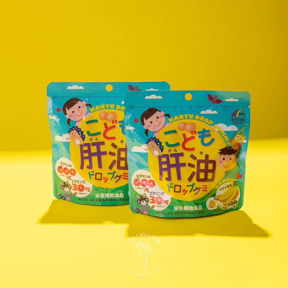 Дві упаковки A, B, C, D Unimat Riken Kids Kanyu Drop Gummy на жовтому тлі
