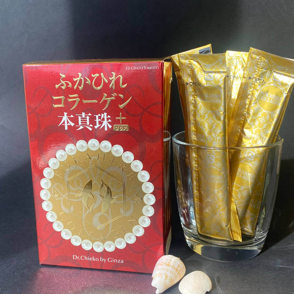 Коробка колагену GINZA TOMATO Shark Fin Collagen Pearl PLUS і стіки в прозорій скляній склянці 