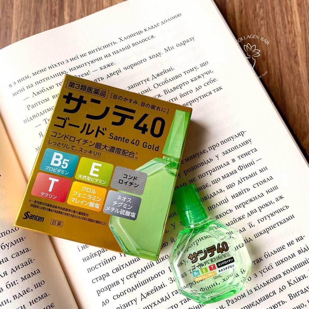 Очні краплі Sante 40 Gold на відкритій книжковій сторінці. Текст українською мовою.