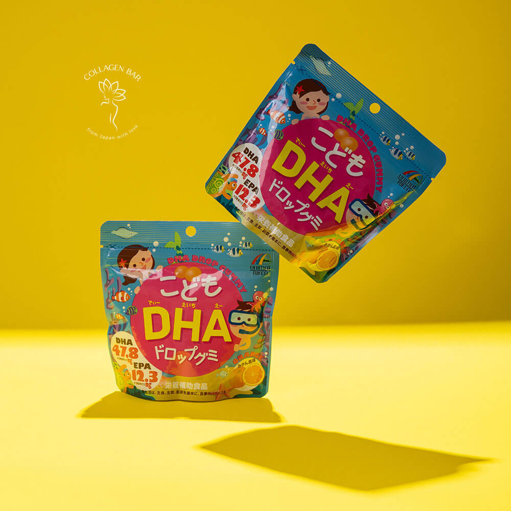 Дві упаковки дитячого мармеладу Unimat Riken Kids DHA з Омега-3 на жовтому тлі