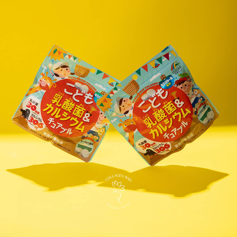 Дві упаковки Unimat Riken Kids Lactic Bacteria & Calcium на жовтому тлі