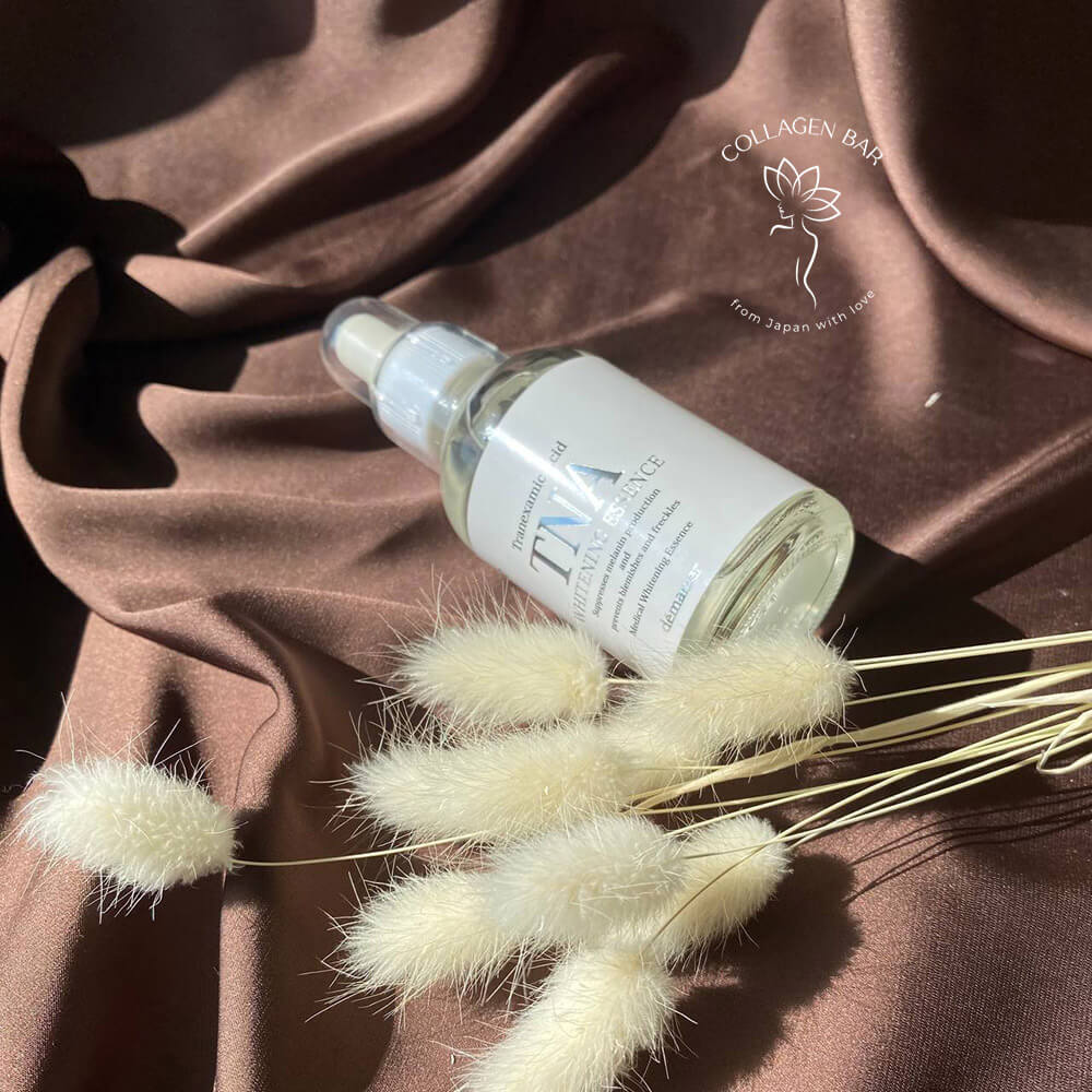 Флакон эссенции без коробки DEMARRER TNA Whitening Essence на коричневой ткане с сухими колосьями